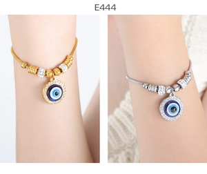 Detailed comparison of gold and silver evil eye snake chain bracelets with pavé crystals