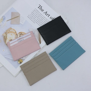 Flat lay of colorful pebble grain leather card holders with multiple card slots