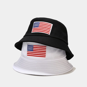 Classic black and white bucket hats with embroidered American flag patches for sun protection
