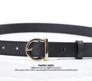 Close-up of black leather belt with golden D-shaped metal buckle on a white surface