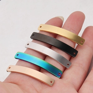 Detailed view of curved stainless steel rectangle connector tags in five metallic colors
