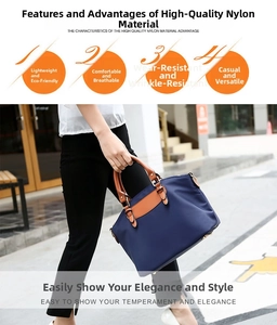 Close-up of durable navy blue nylon tote with brown leather handles and premium stitching