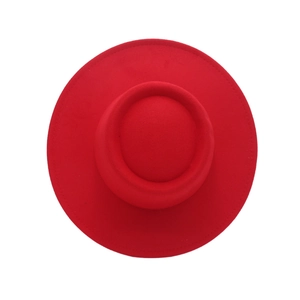 Top view of red wool felt hat with flat top, wide brim and detailed stitching on white background