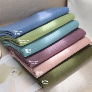 Close-up of thick cashmere feel scarves in various colors showing soft fabric texture