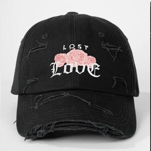 Detailed embroidery of pink roses and LOST LOVE text on distressed black baseball cap
