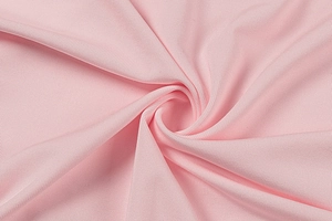 Makroaufnahme von rosa geripptem Strickstoff mit feiner vertikaler Webstruktur
