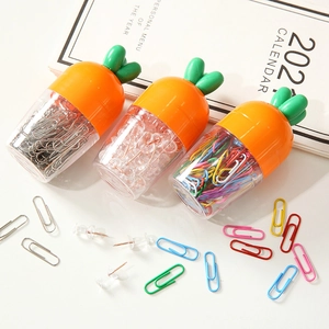 Creative carrot-shaped stationery set with paper clips and push pins in storage jars