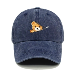 Detail of vintage washed denim baseball cap with creative zipper bear print and embroidery