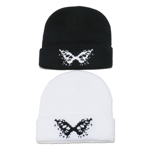 Winter knitted beanie set in black and white featuring jacquard butterfly patterns