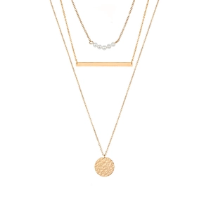 Three-layer gold stainless steel necklace with pearl, bar, and hammered disc pendants