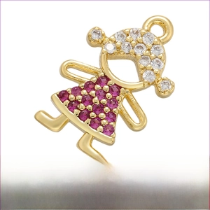 Macro view of gold plated brass girl pendant with pink gems and white zircon inlay