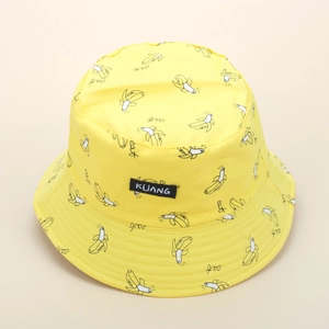 Reversible yellow bucket hat with banana print and woven label for summer sun protection