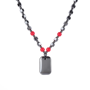 Hematite necklace with faceted grey beads, red round accents and a rectangle stone pendant
