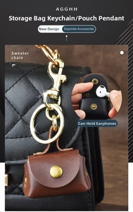 Retro brown PU leather mini bag keychain used as a headphone case on a backpack