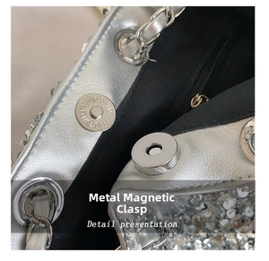Detail view of the silver sequin bag magnetic buckle and textured fabric lining