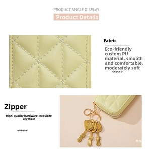 Detail of quilted beige PU leather bag with premium gold hardware and smooth zipper