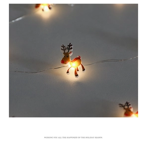 Close-up of reindeer shaped LED light emitting warm yellow glow for holiday decoration