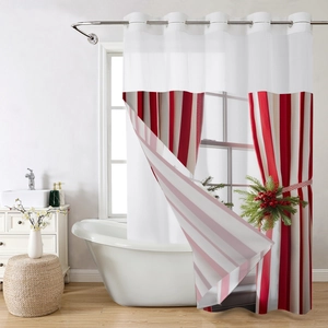 Detail of red and white striped shower curtain with Christmas pine and berry tieback