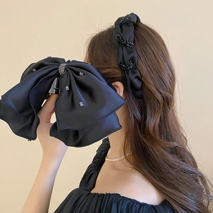 Pince à cheveux nœud géant en satin noir et bandeau perlé avec détails en strass chic