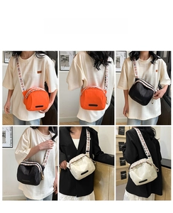 Close-up of nylon shell crossbody bag with bohemian floral print wide shoulder strap