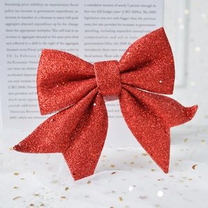 Sparkly red glitter bow ornament for Christmas tree and festive wall decoration