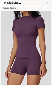 Detail view of plum purple slim fit yoga set featuring short sleeve top and athletic shorts