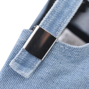 Detail showing the adjustable metal buckle and stitching on the washed denim cap back