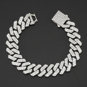 Close-up of silver-tone Cuban link necklace with densely set sparkling rhinestones