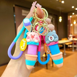 Cartoon animal ice cream silicone keychain featuring pink pig and cat charms with gold ring