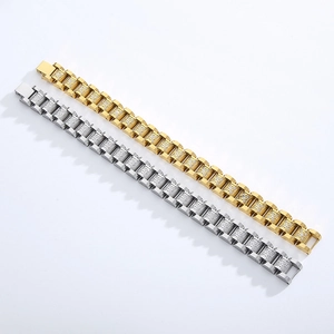 Detail of hip hop style gold and silver stainless steel bracelets with CZ stone settings