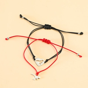 Close-up of woven adjustable bracelets with stainless steel dinosaur and heart charms