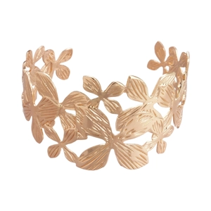 Golden cutout flower bangle bracelet with wide metallic hollow floral pattern design