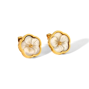 Detailed close-up of golden stainless steel flower earrings with white mother of pearl petals
