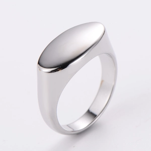 Macro detail of minimalist silver oval ring with a smooth polished mirror finish