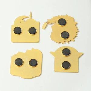 Back view of gold metal Shanghai magnets showing dual round black magnets on white background