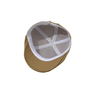 Inside detail of khaki baby beret cap with breathable mesh lining and sweatband