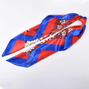 Close-up of floral print satin silk scarf with red, blue, and white chrysanthemum pattern