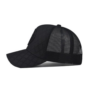 Black outdoor trucker cap with mesh back and geometric pattern visor, side view profile
