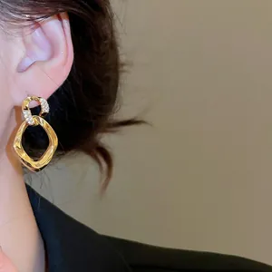 Elegant champagne gold twisted geometric earrings with zircons for a luxury jewelry look