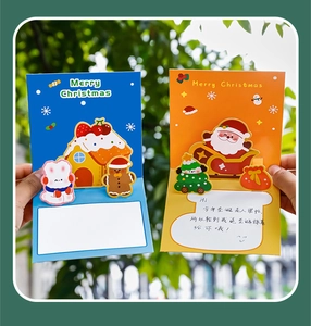 3D pop-up Christmas card detail showing Santa and reindeer cutout designs with message space