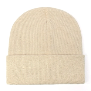Detailed close-up showing the fine knit texture and classic cuff design of the beige beanie
