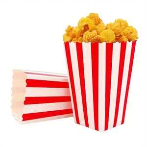 Classic red and white striped popcorn buckets with popcorn on a plain white background