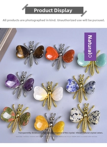 Detail of diverse butterfly brooches with natural crystal wings and alloy frames