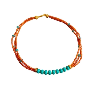 Three-strand vintage beaded necklace with orange seed beads and green zircon accents