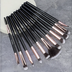 Detail of 12pcs professional makeup brush set with black handles and rose gold ferrules