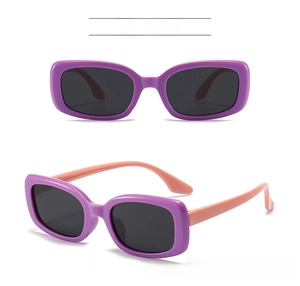 Detail view of square kids sunglasses with purple frame and light pink silicone legs