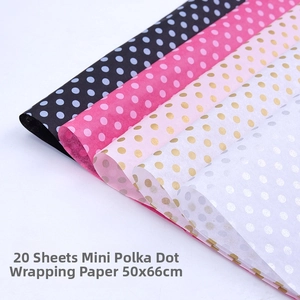 Close-up of 20 sheets of polka dot tissue paper in multiple colors for gift wrapping