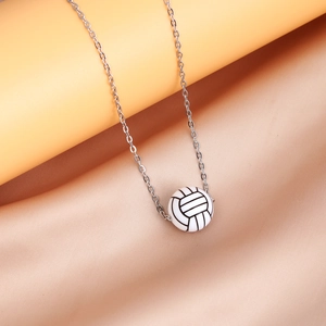 Detailed close-up of a stylish white and black volleyball pendant on a polished silver chain