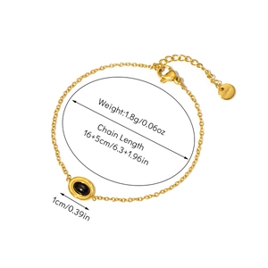 Detail of 18K gold-plated bracelet showing 16+5cm length and black oval gemstone