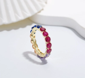 Macro detail of 4mm gold-plated sterling silver ring with colorful gradient cubic zirconia